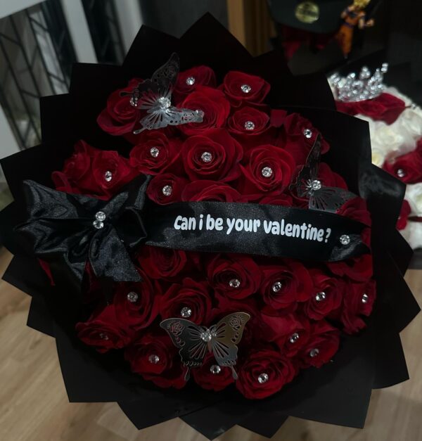 Red roses with glitter and ribbon