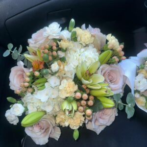 Bouquet of pink roses with flowers